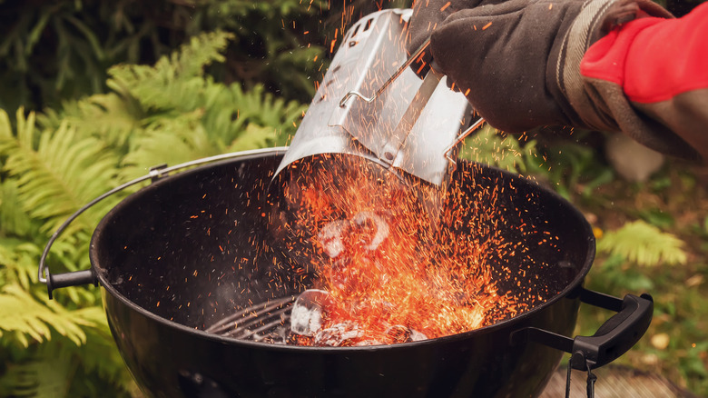 chimney starter pouring into grill