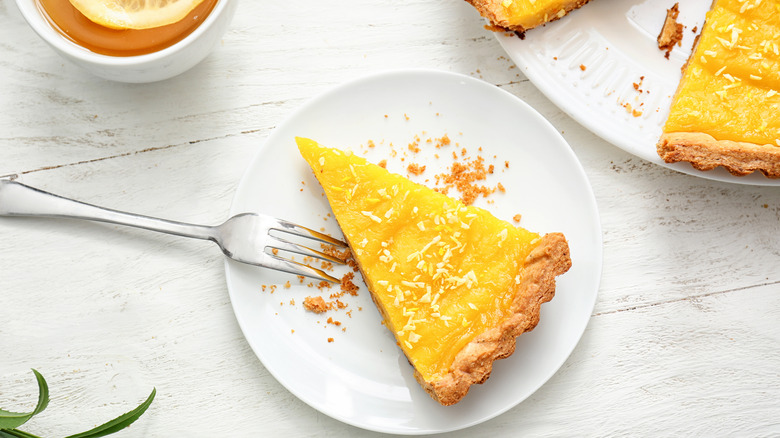 slice of lemon pie on plate on table