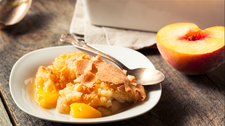 Peach cobbler on plate with spoon 