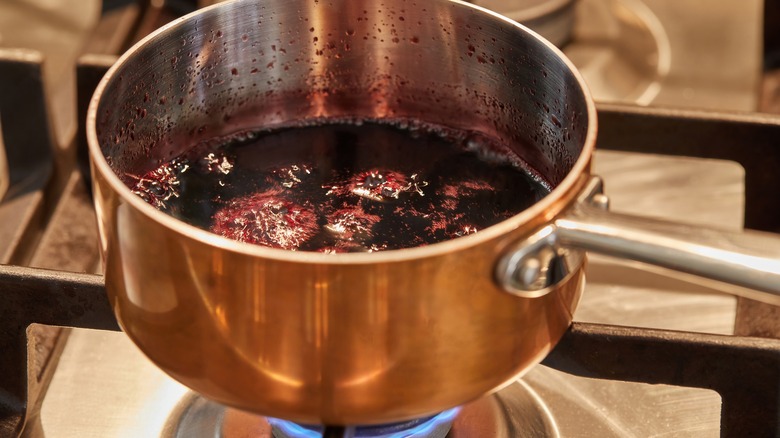 simmering liquid on stove