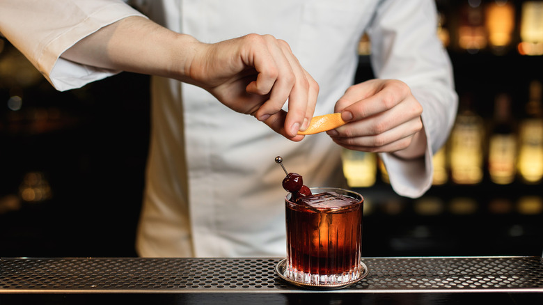 bartender prepping rocks glass drink