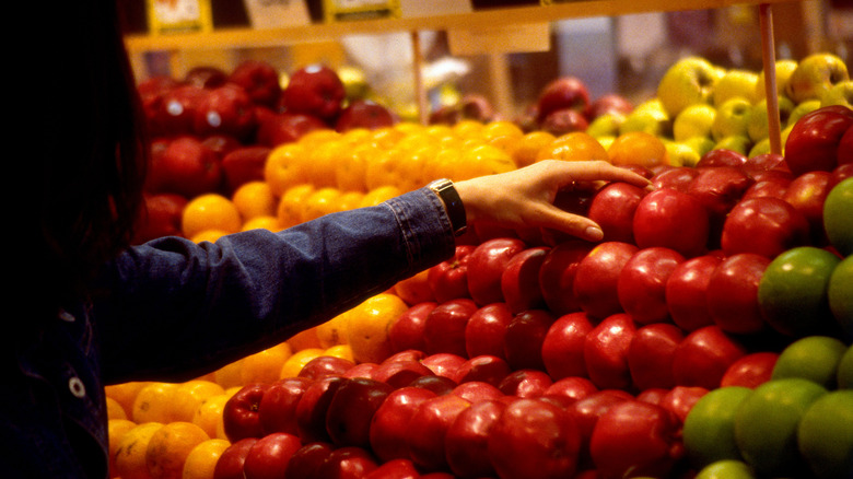 Person selecting apples