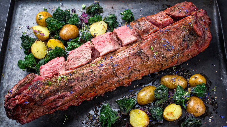 Venison tenderloin with potatoes and greens