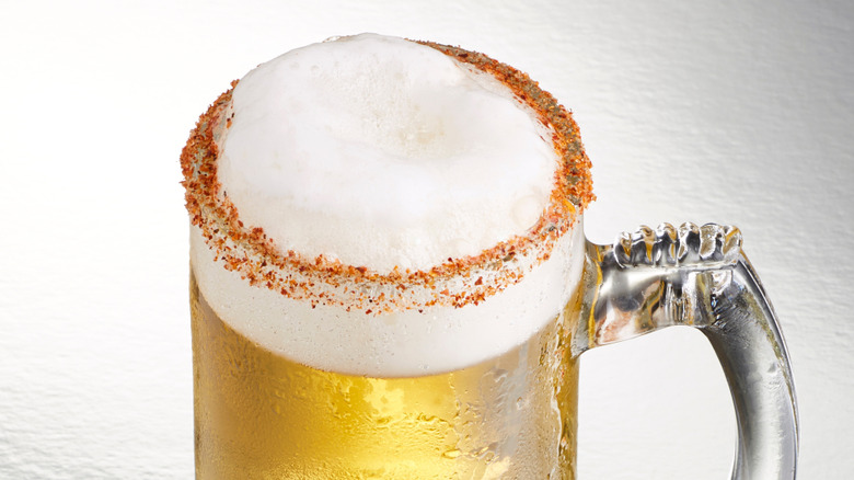 Filled beer glass with beer salt on rim