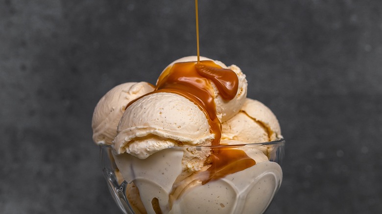 Syrup being poured on ice cream