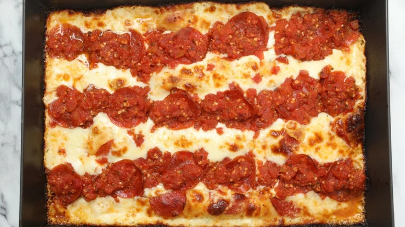 https://www.thedailymeal.com/img/gallery/what-is-detroit-style-pizza/l-intro-1664224103.jpg