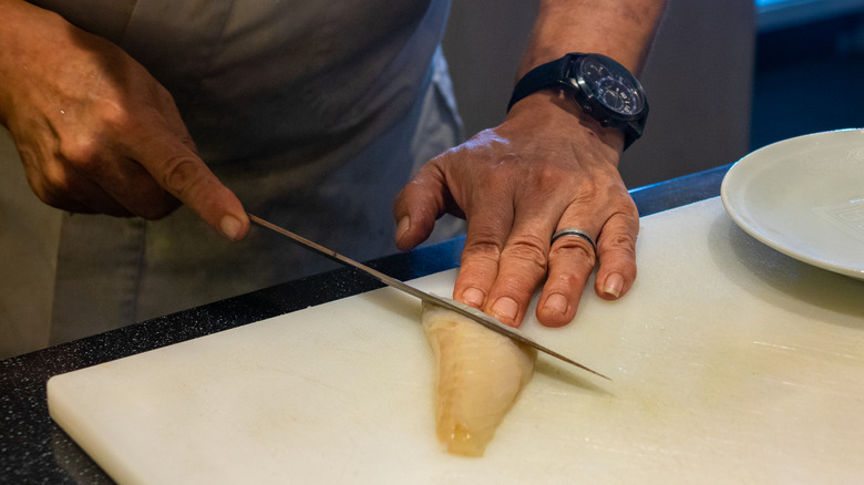 Chef slicing a fugu fillet