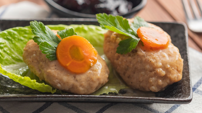 two gefilte fish balls on plate 