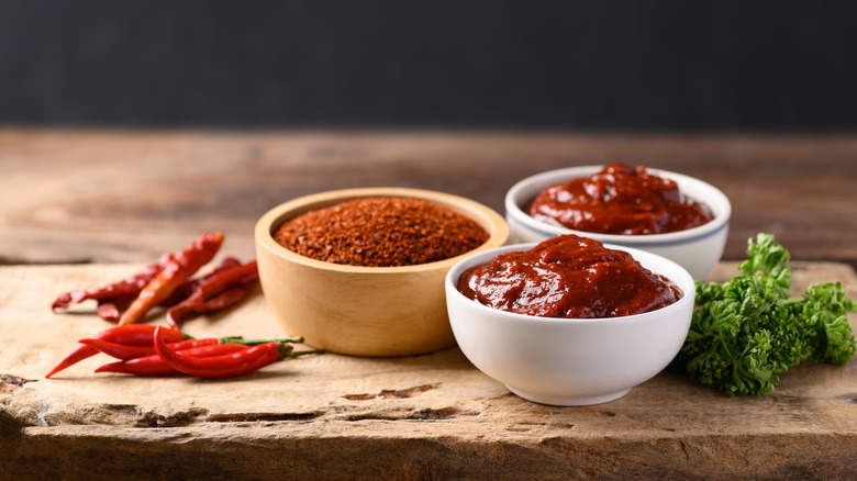 Bowls of gochujang and gochugaru