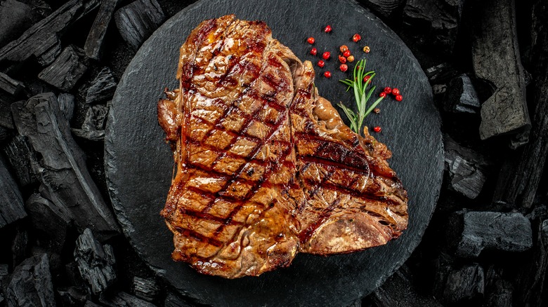 sirloin steak on plate with pomegranate seeds