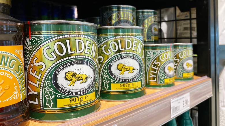 Containers of golden syrup