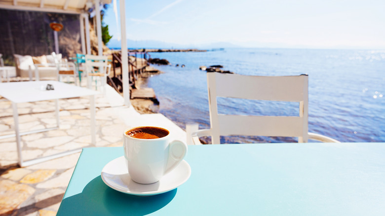 Cup of coffee at a table seaside