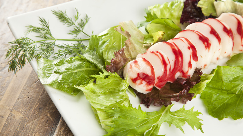 Imitation lobster slices on vegetables