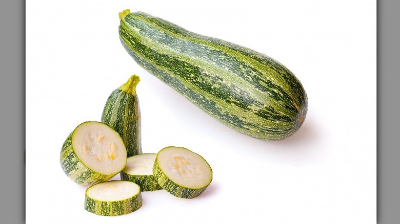 Whole and cut marrow squash