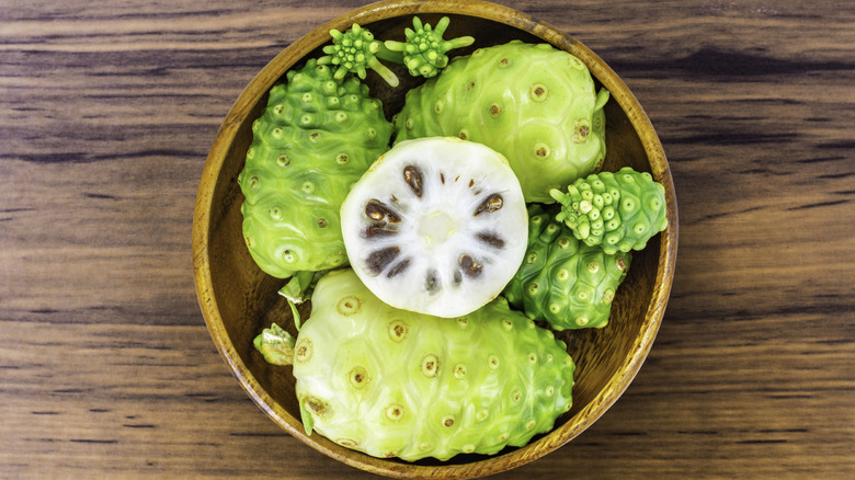 Sliced noni fruit in bowl