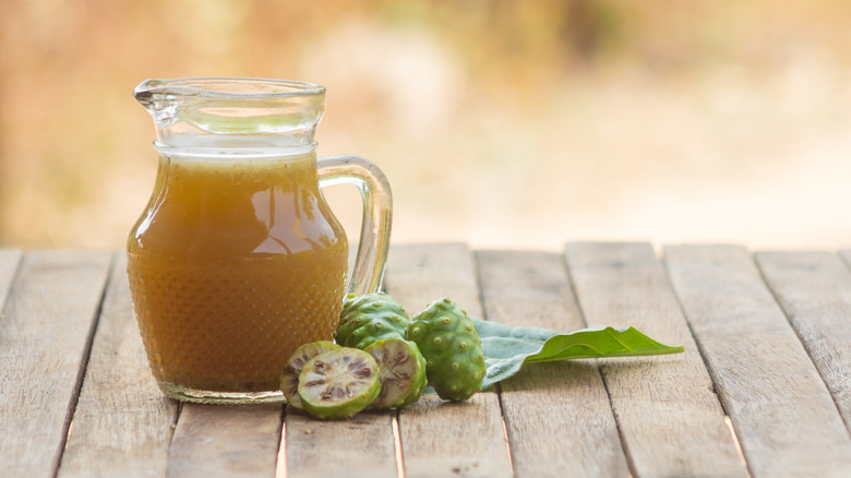 Noni juice pitcher on table