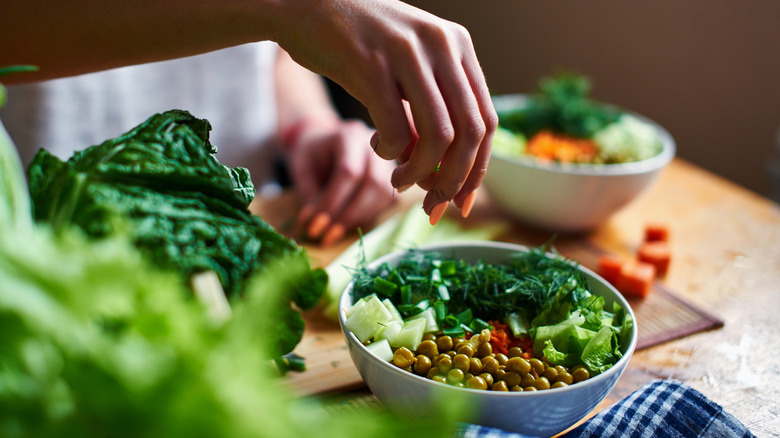 Woman making a pea salad