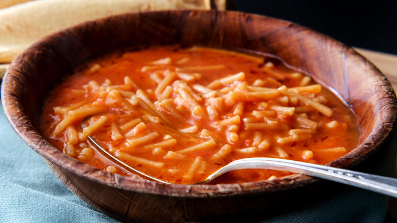 Sopita in a brown bowl with a spoon