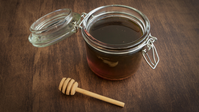 jar of sorghum syrup on table
