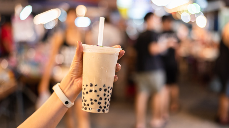 Hand holding boba tea