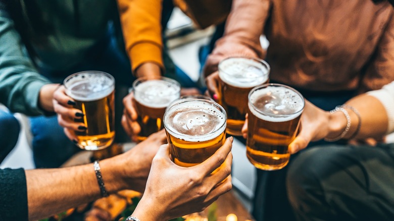 group holding glasses of beer