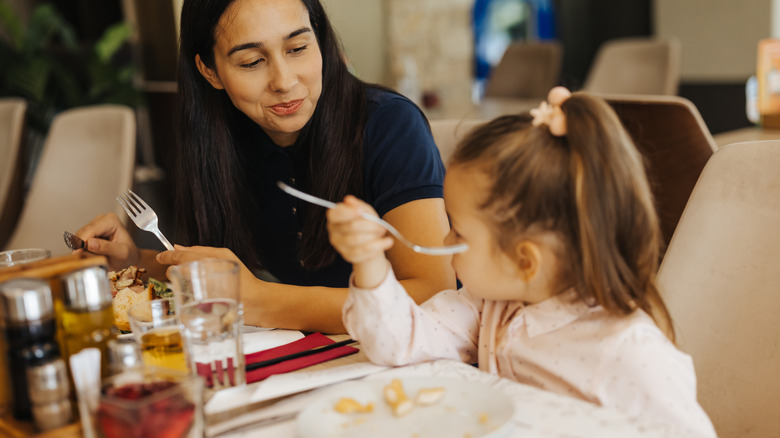 mother and daughter at restaurant