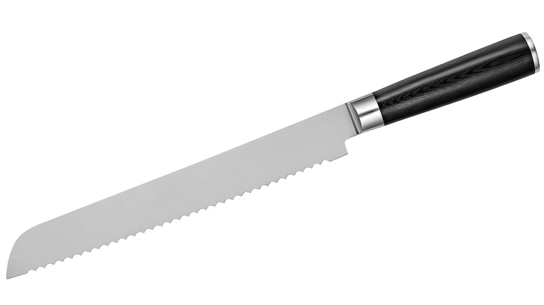 serrated bread knife white background