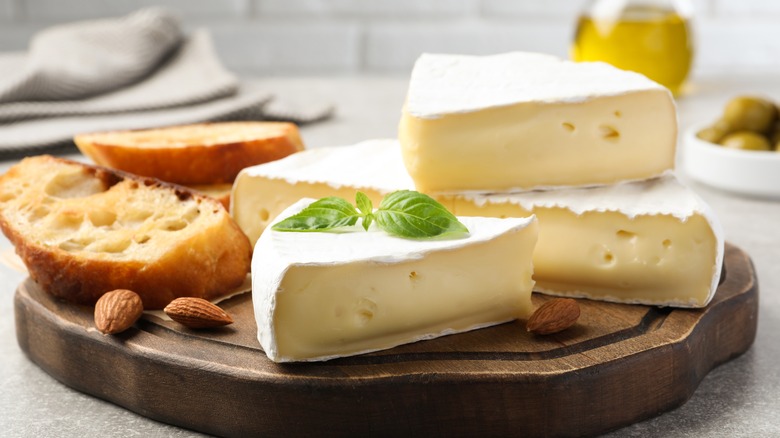 Sliced brie on a cutting board