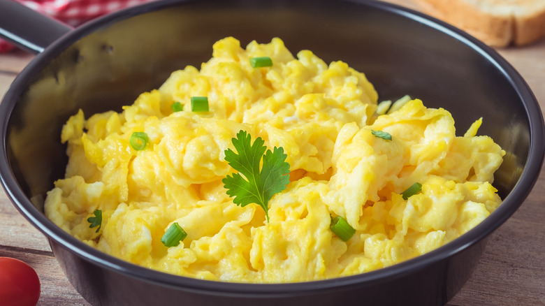 Scrambled eggs served in a small pan