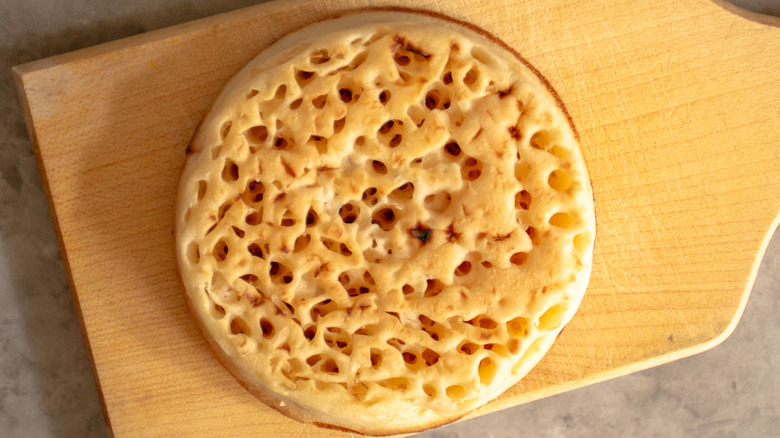 crumpet on wooden board 