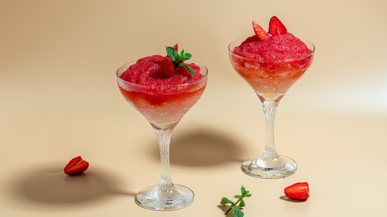 two red frozen strawberry cocktails