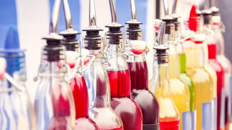 lineup of bottles of flavoring syrups