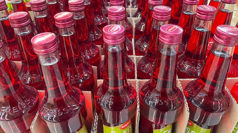 bottles of red syrup on sale