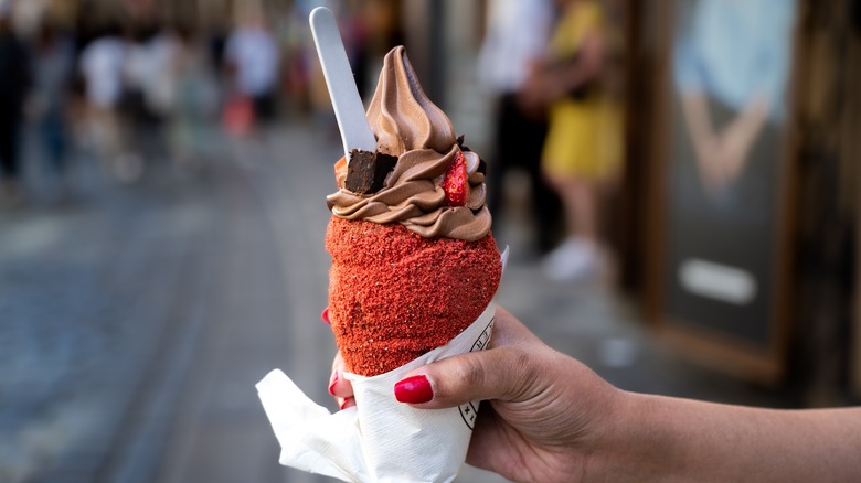 Red trdelnik filled with chocolate ice cream