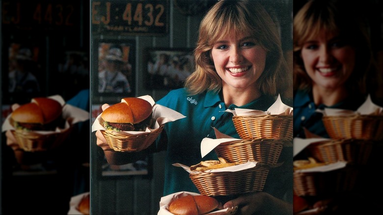 vintage promo image of a server with baskets of food