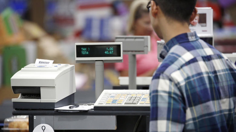 Cashier at Costco register 