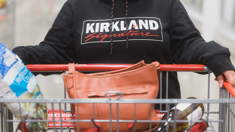 Costco shopper in Kirkland hoodie