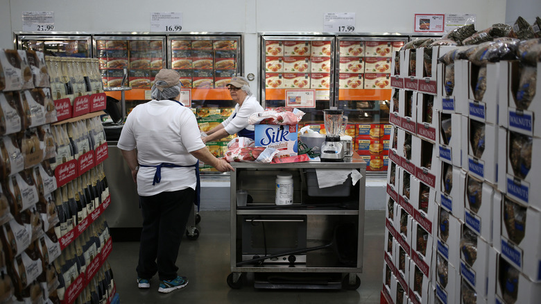 Costco employees preparing free samples