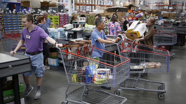 Costco employee checking people out