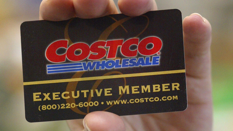 Costco member card in hand