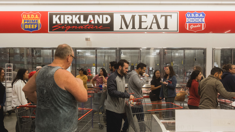 Costco shoppers in meat section