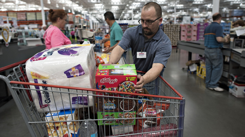 Costco employee loading cart 