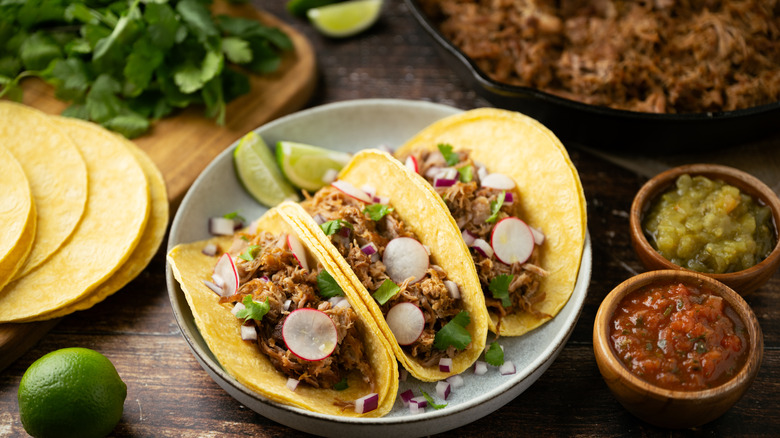 Three carnitas tacos with fixin's