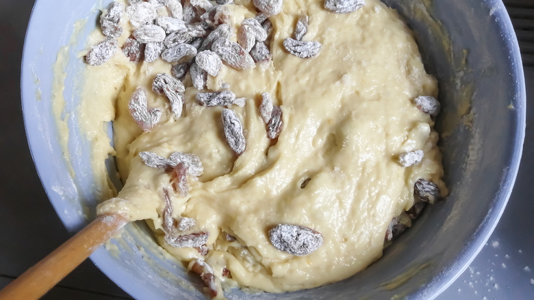 mixing raisins in cake dough