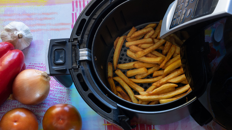 air fryer basket filled with french fries
