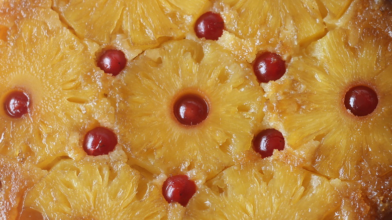 Pineapple slices and cherries on a dessert