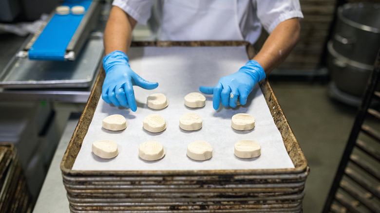 baking shortbread dough on a baking tray with parchment paper