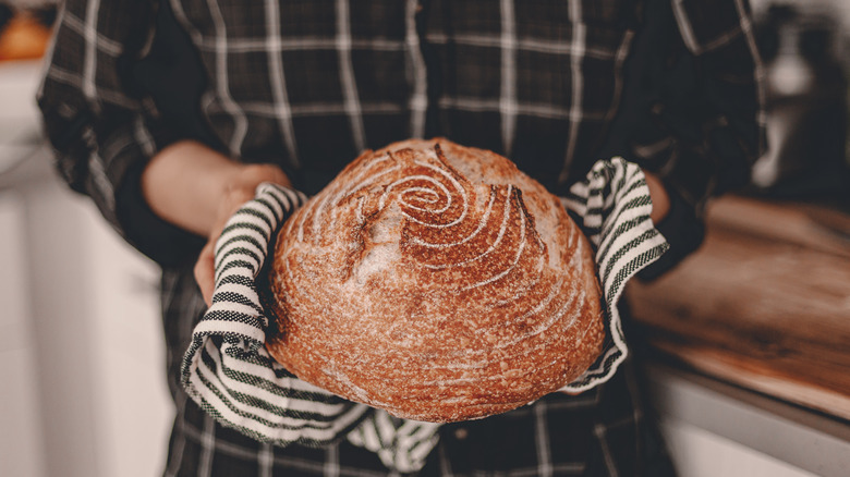 Woman holding a potato bread