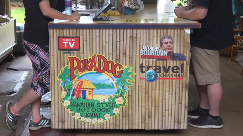 Side of the Puka Dog stand with Travel Channel promo graphics