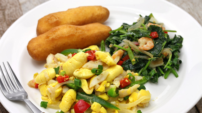 Plate of Jamaican festival with ackee and saltfish